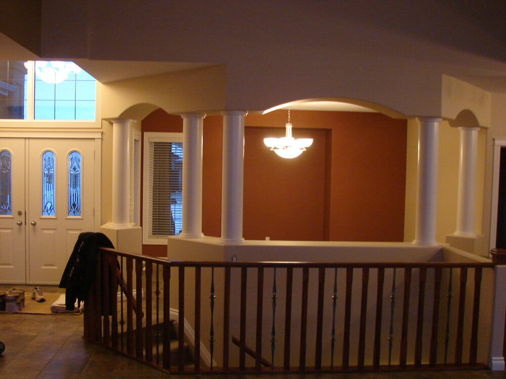 Painted interior with detailed columns, arches and feature walls